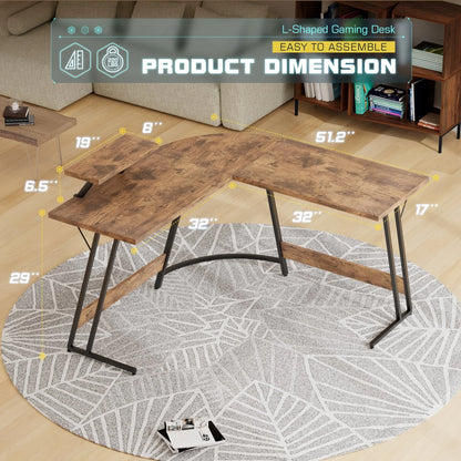 L-shaped brown wood grain gaming desk with black metal frame on round gray patterned rug
