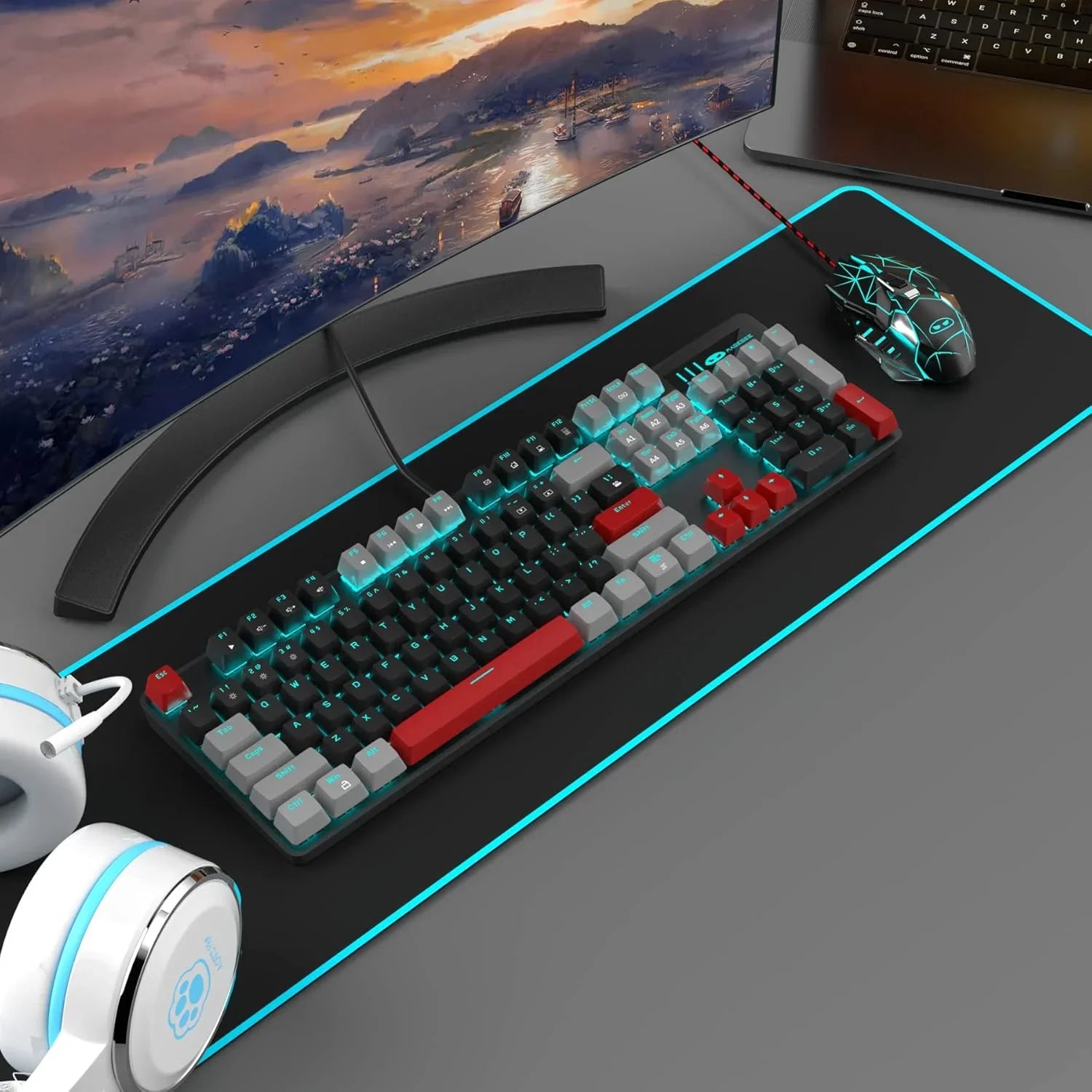 Gaming keyboard with red, black, and gray keycaps with RGB backlight on extended mouse pad, gaming mouse, headset, and curved monitor