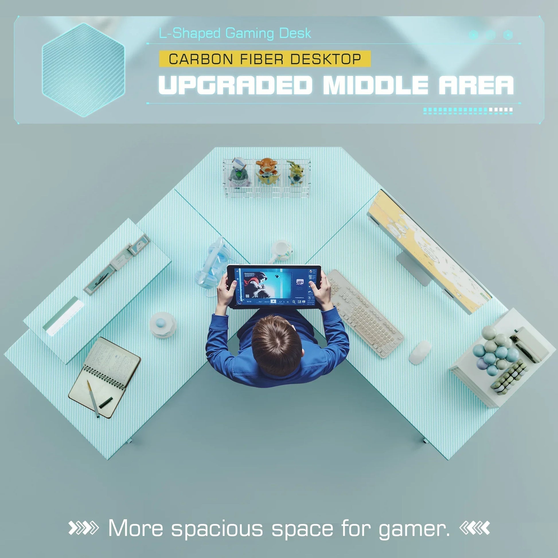 Top view of person holding tablet at L-shaped gaming desk with carbon fiber desktop and gaming setup