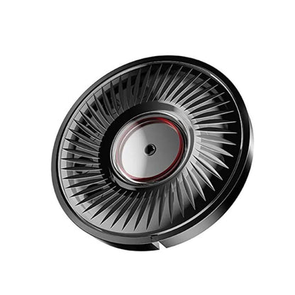 Close-up of a black gaming headset speaker driver on white background