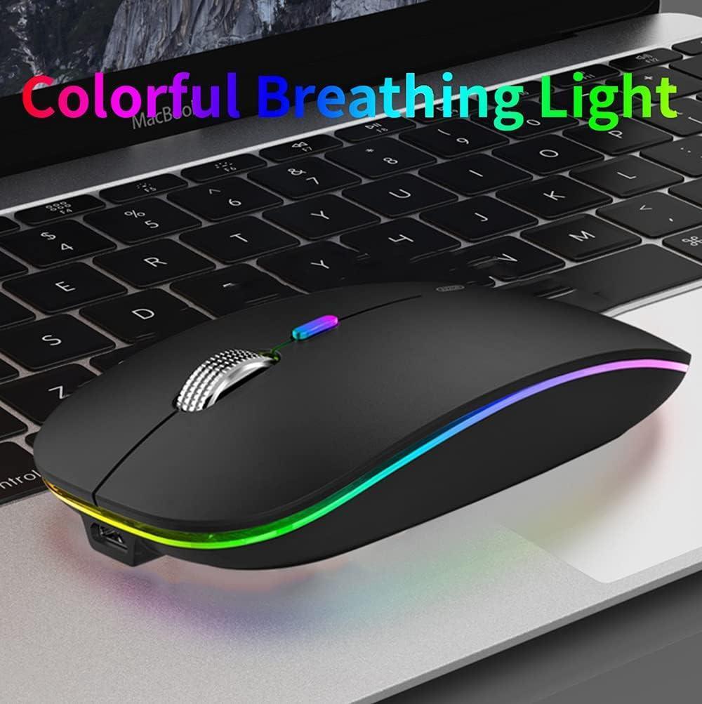 Wireless RGB gaming mouse with colorful LED lights on laptop keyboard