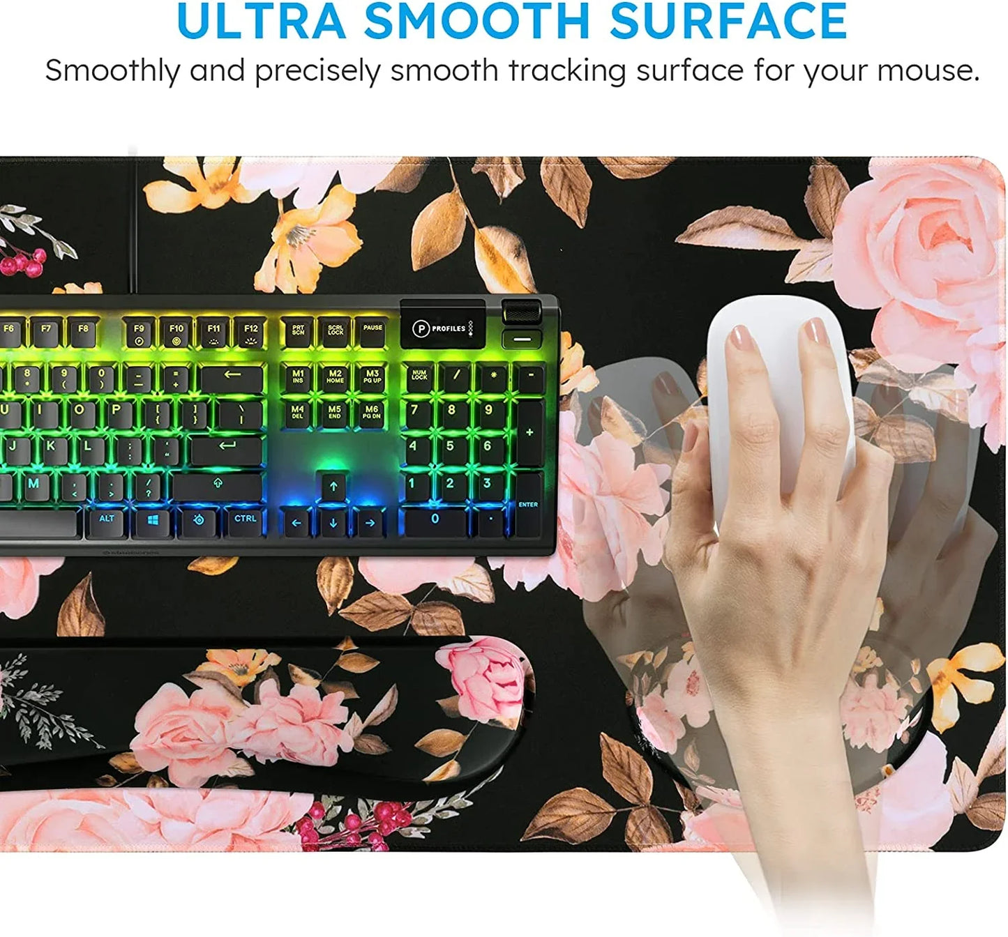Gaming keyboard with RGB keys and floral mouse pad showing ultra smooth surface for precise mouse tracking