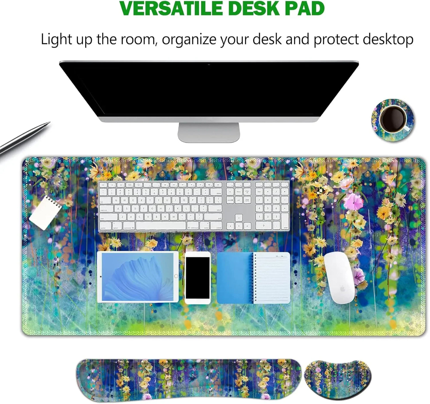 Colorful floral-themed versatile desk pad with keyboard, mouse, tablet, phone, notebook, and matching wrist rests