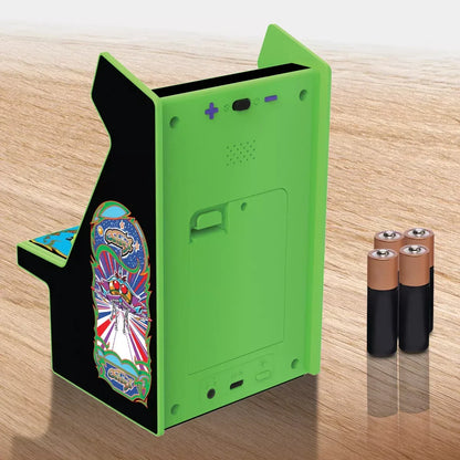 Back of green mini retro arcade cabinet with batteries on wood surface, Byte Style gaming gear
