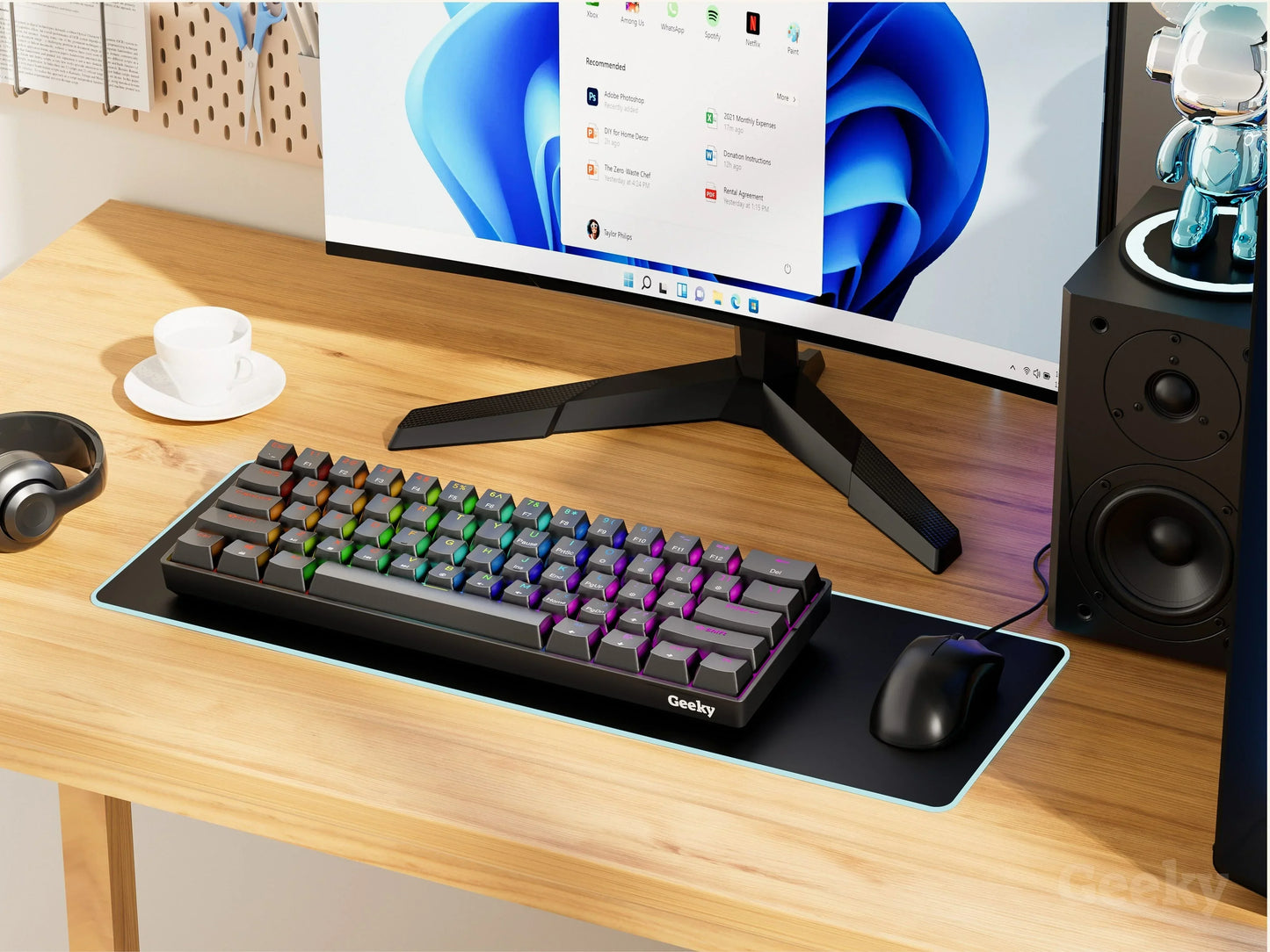 RGB mechanical keyboard, gaming mouse, and monitor on a modern gaming desk setup