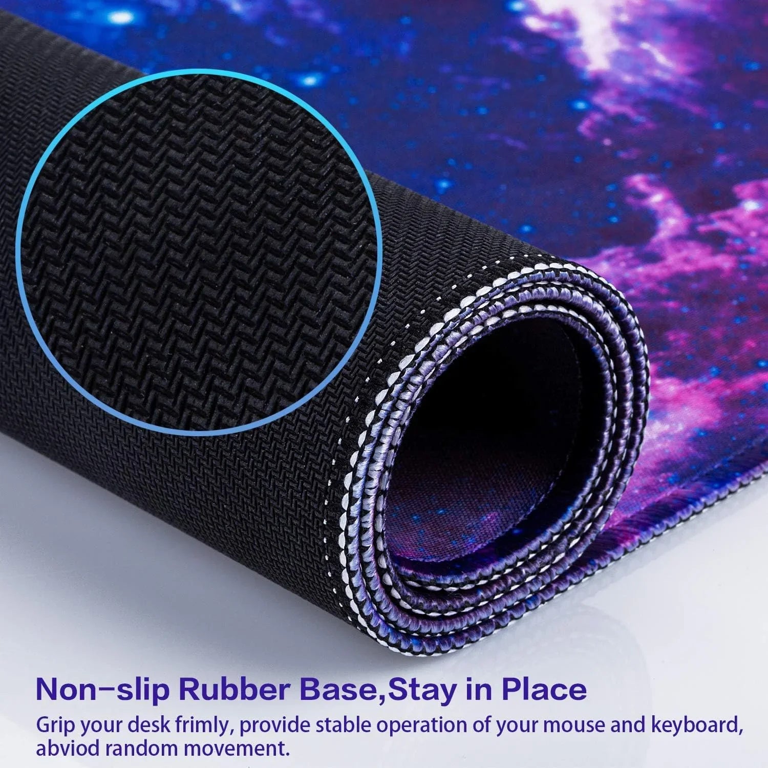 Rolled gaming mouse pad with non-slip rubber base and galaxy-themed surface for stable desk grip