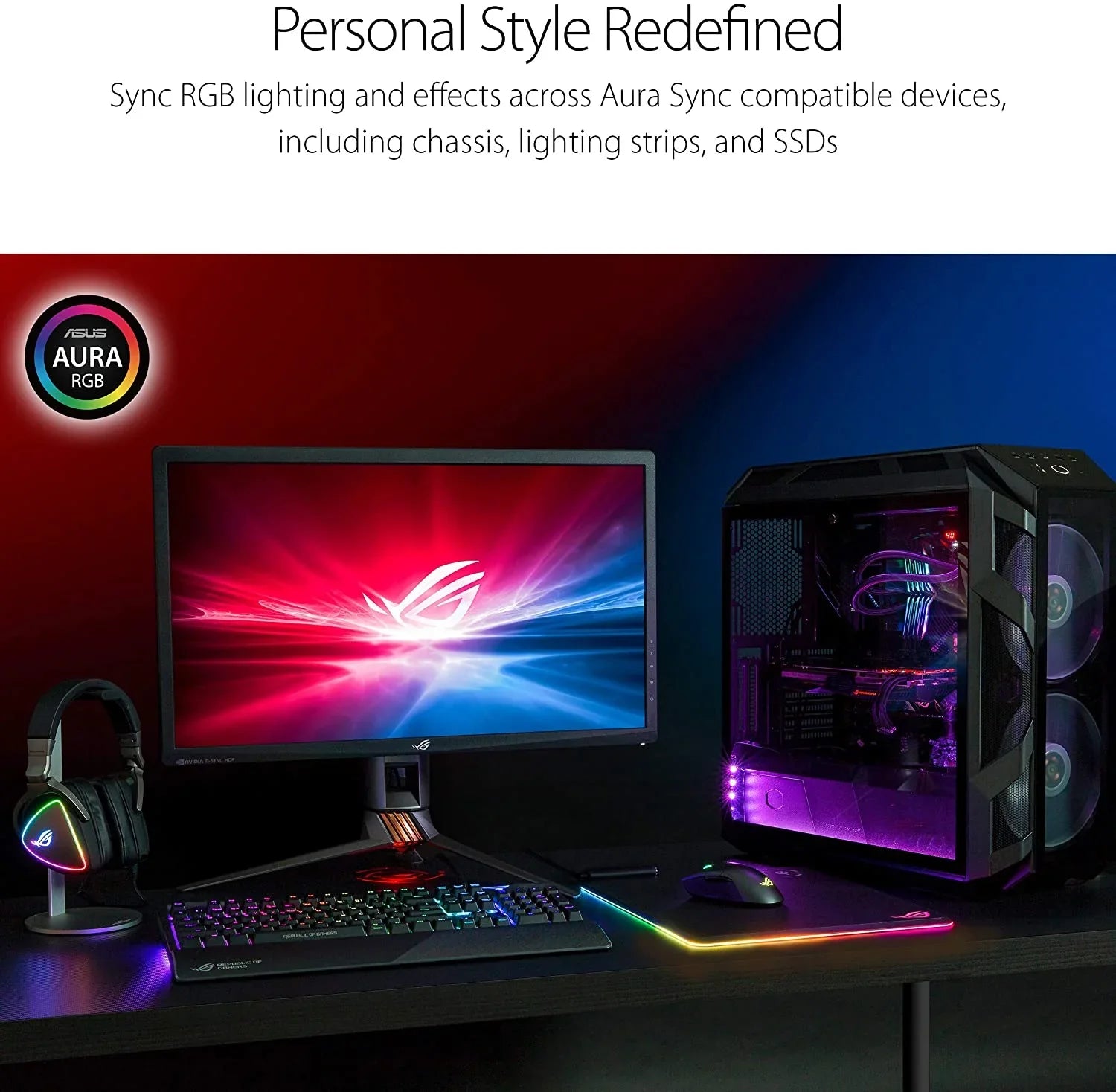 Gaming setup with ASUS Aura RGB desktop PC, monitor, mechanical keyboard, RGB mouse, and headset on black desk
