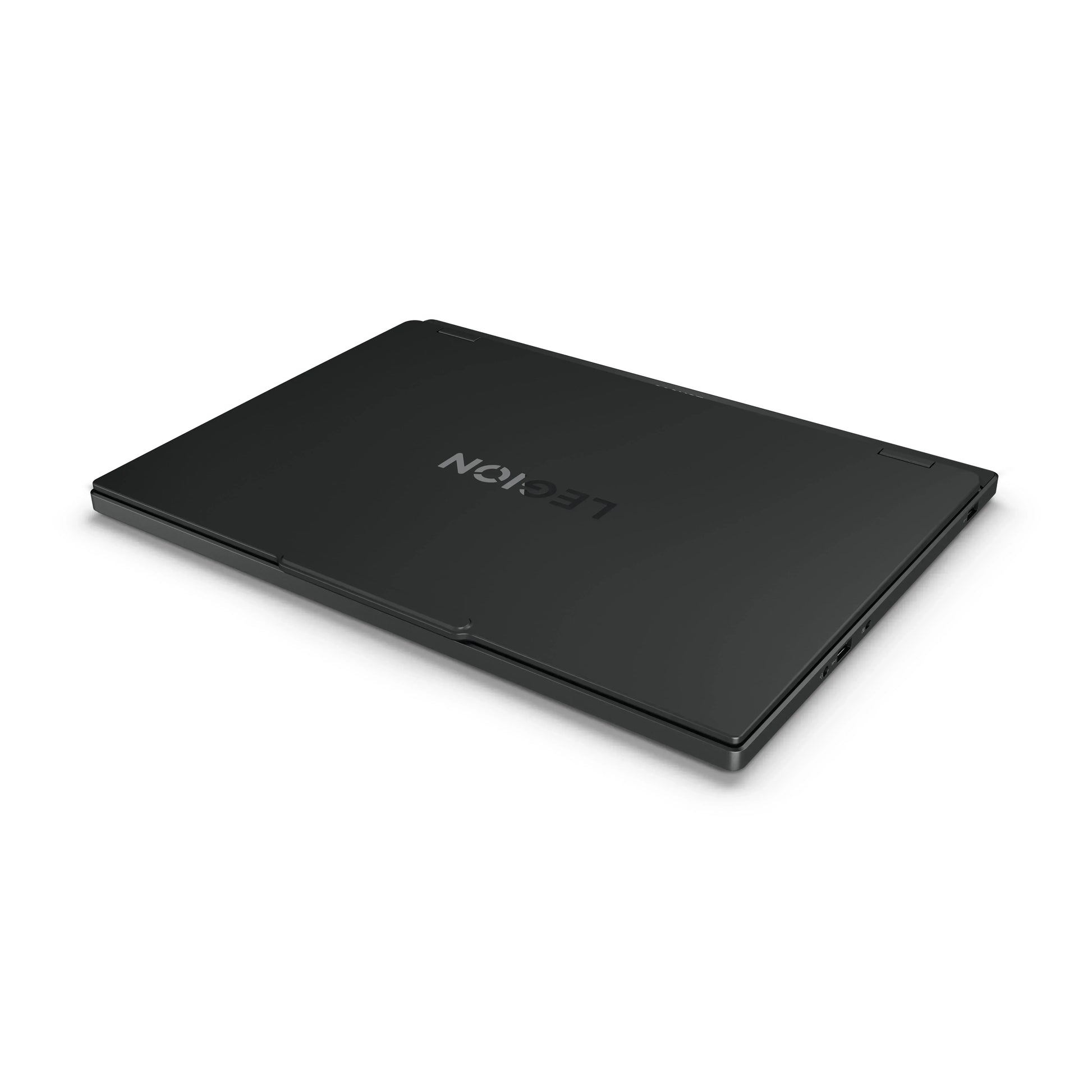 Closed black gaming laptop with sleek design and subtle logo on white background