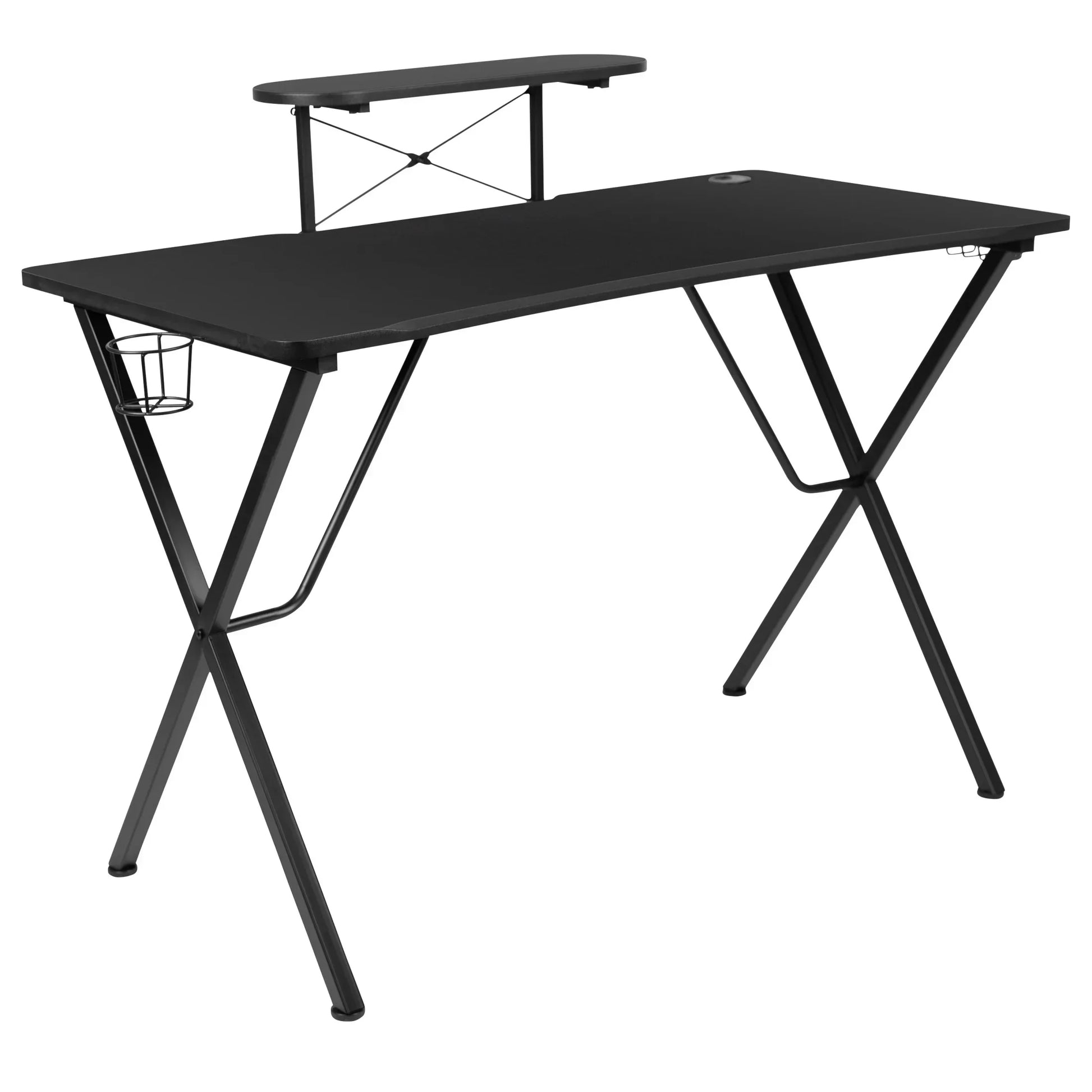 Black gaming desk with X-shaped metal legs, raised monitor shelf, and side cup holder