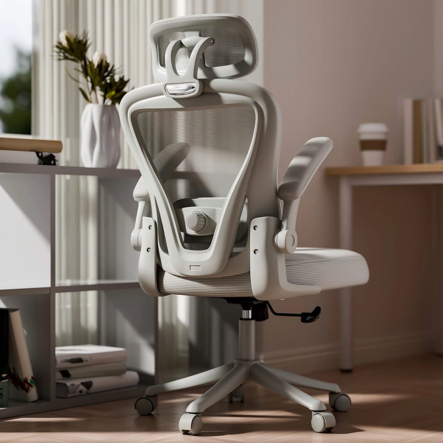 Ergonomic mesh office chair with headrest, adjustable arms, and lumbar support for gaming or work setup