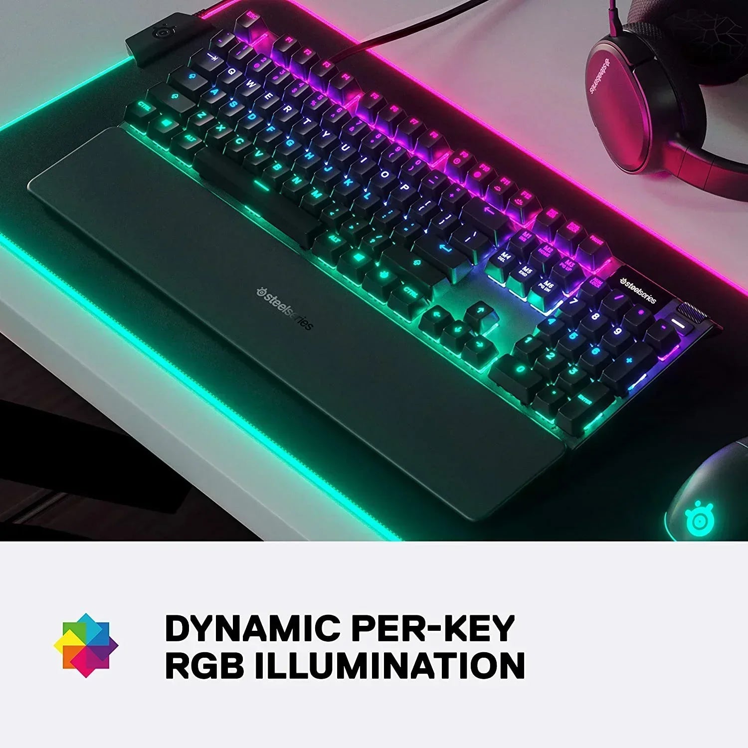 RGB gaming keyboard and mouse on desk with SteelSeries headset, dynamic per-key illumination