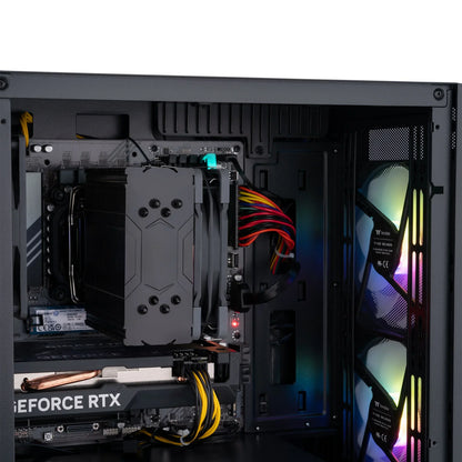 Inside view of gaming PC case with GeForce RTX graphics card, large CPU cooler, and dual RGB fans