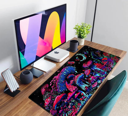Modern desk setup with colorful psychedelic mushroom gaming mousepad, Apple Mac mini, monitor, and cup
