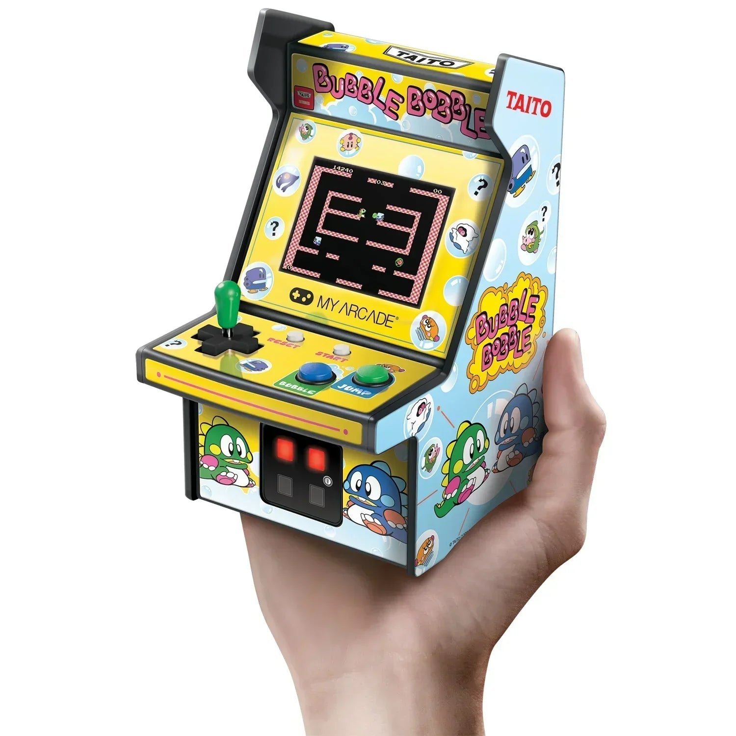 Hand holding a mini Bubble Bobble retro arcade machine with joystick and colorful 8-bit graphics