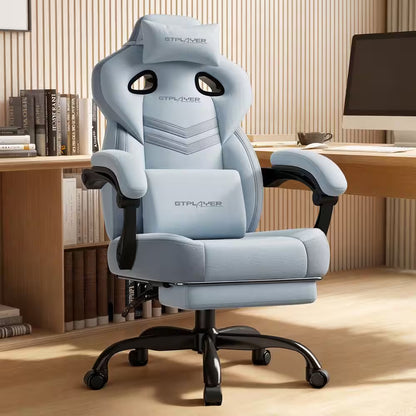 Light blue GTPLAYER gaming chair with lumbar pillow, headrest, and footrest in modern desk setup