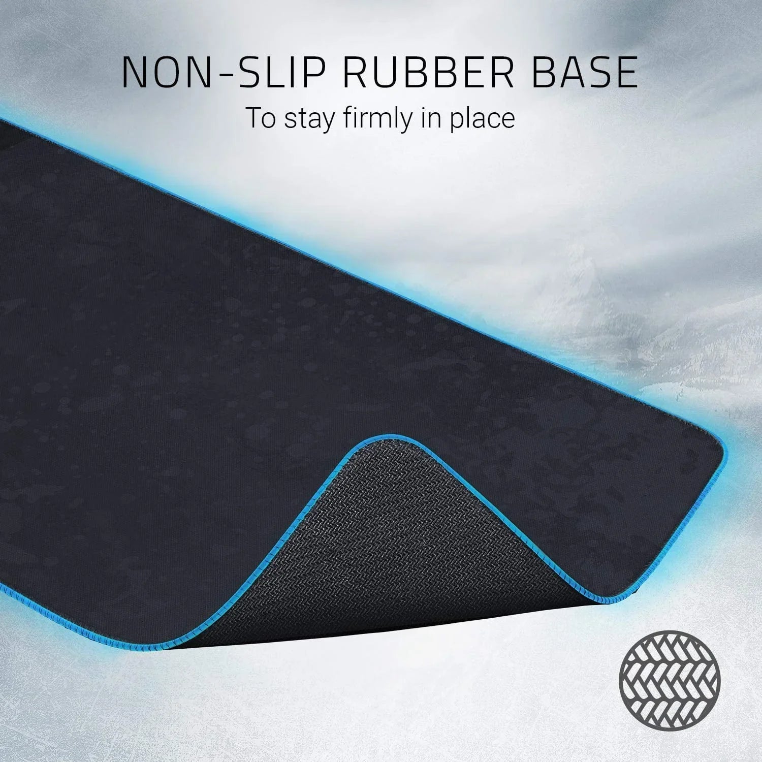 Gaming mouse pad with non-slip rubber base and blue stitched edges for stable, firm placement