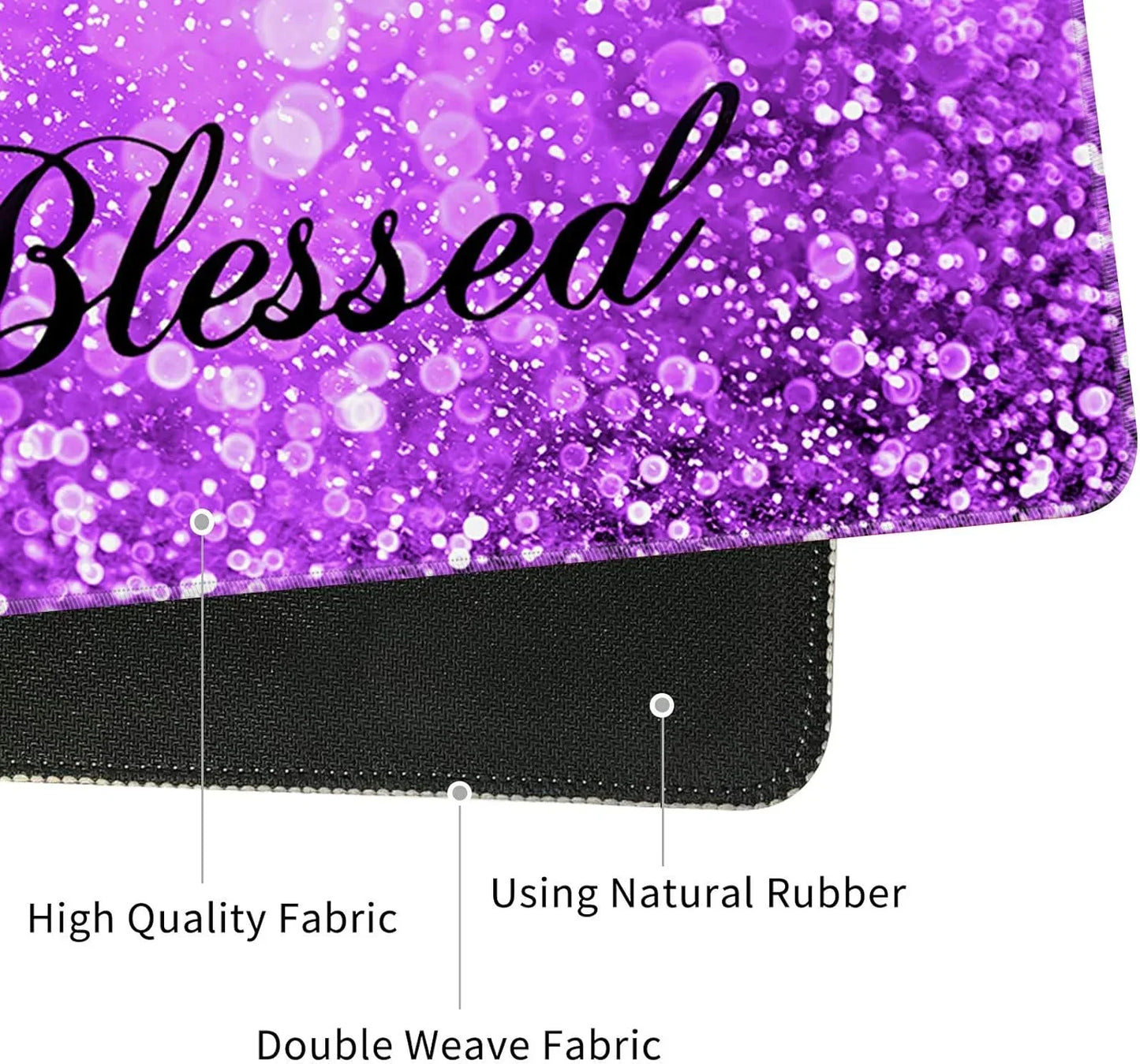 Close-up of a purple gaming mouse pad with the word 'Blessed' on glittery fabric, featuring high-quality double weave fabric and natural rubber base