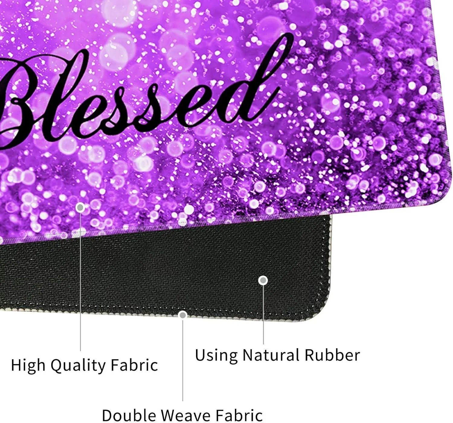 Close-up of a purple gaming mouse pad with the word 'Blessed' on glittery fabric, featuring high-quality double weave fabric and natural rubber base