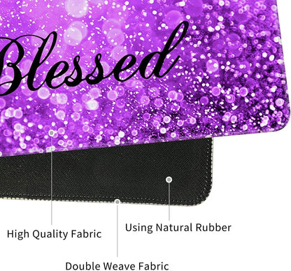 Close-up of a purple gaming mouse pad with the word 'Blessed' on glittery fabric, featuring high-quality double weave fabric and natural rubber base