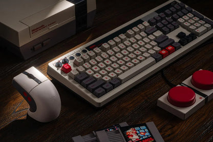 Retro gaming keyboard and mouse set with NES-inspired design, joystick, and game cartridges