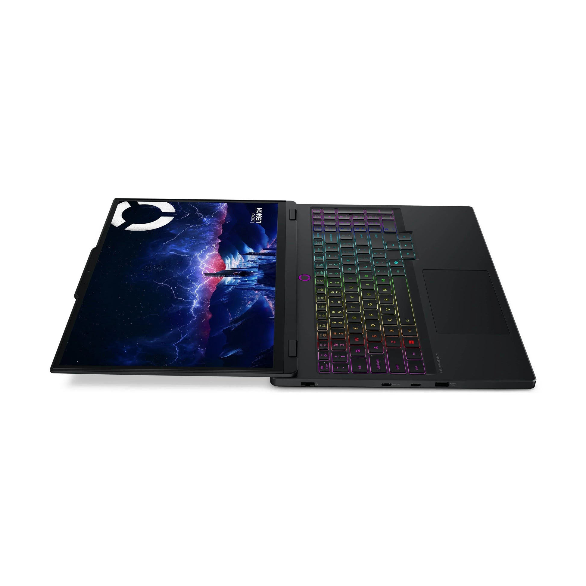 Gaming laptop with RGB keyboard and screen displaying sci-fi cityscape, laid flat open