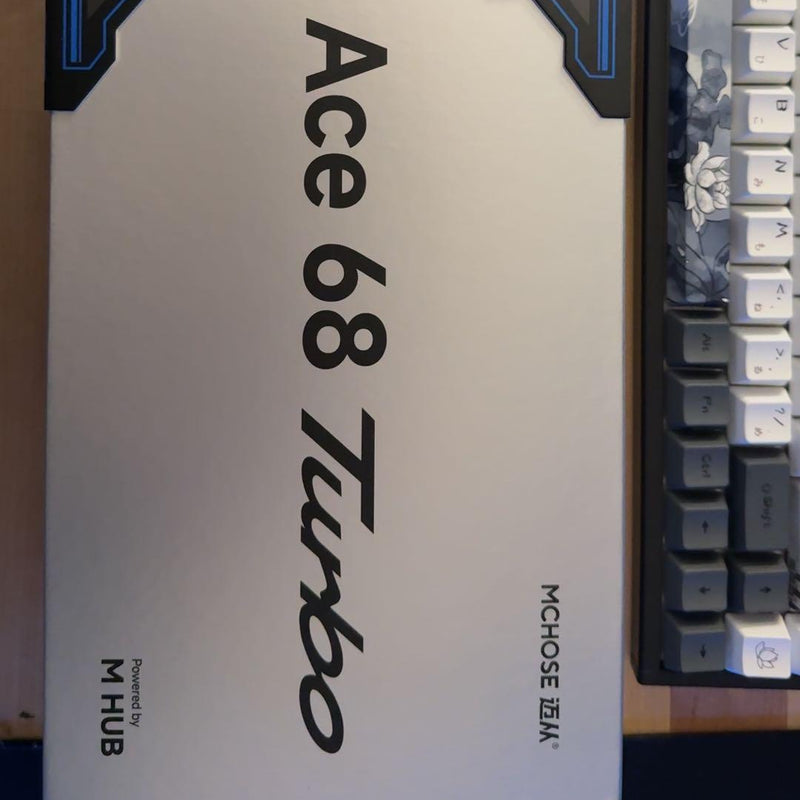 Mousie Ace 68 Turbo keyboard switch packaging with a keyboard in the background