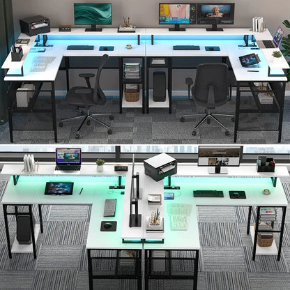 Modern white L-shaped office desks with black mesh legs, dual monitors, laptops, and LED lighting in office space