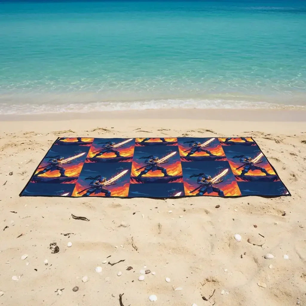 Beach towel with flaming sword warrior print on sandy shore by turquoise ocean