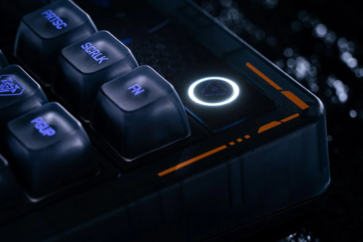 Close-up of a backlit gaming keyboard with illuminated keys and retro 8-bit design accents
