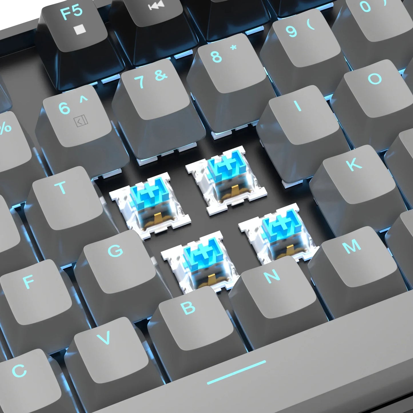 Close-up of gaming keyboard with gray keycaps, blue mechanical switches, and RGB backlighting