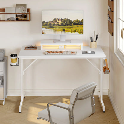 Minimalist white standing desk setup with monitor displaying countryside, mechanical keyboard, mouse, and office chair