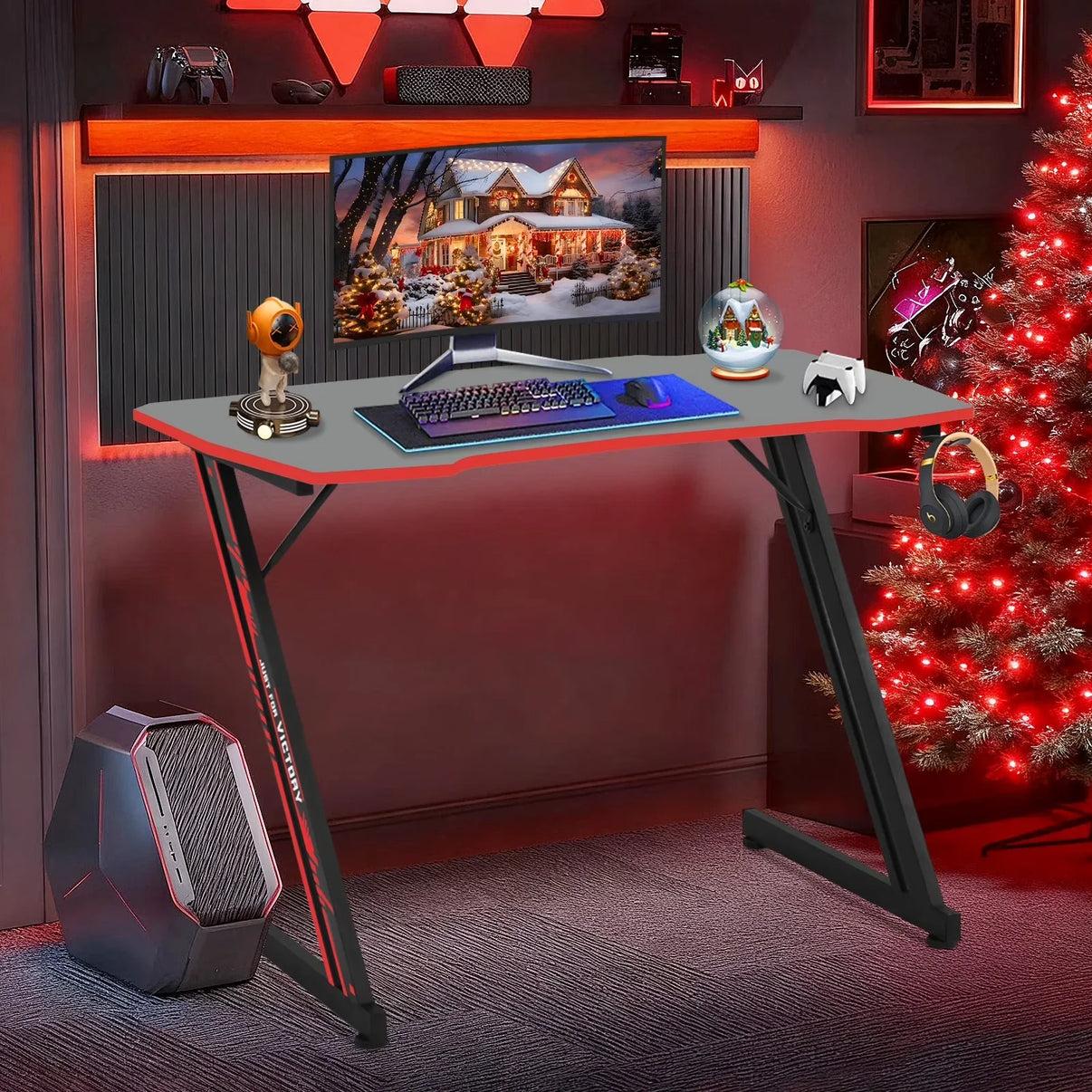 Modern gaming desk setup with curved monitor, keyboard, mouse, gaming PC, and festive Christmas decorations