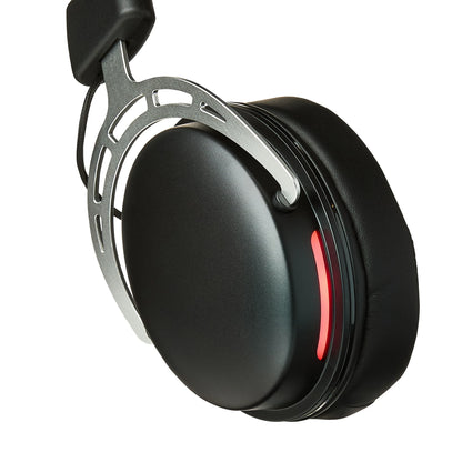 Close-up of black over-ear headphone with metal frame and red accent on earcup