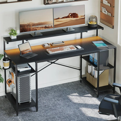 Modern black carbon fiber desk with dual monitors, laptop, tablet, mechanical keyboard, and office accessories