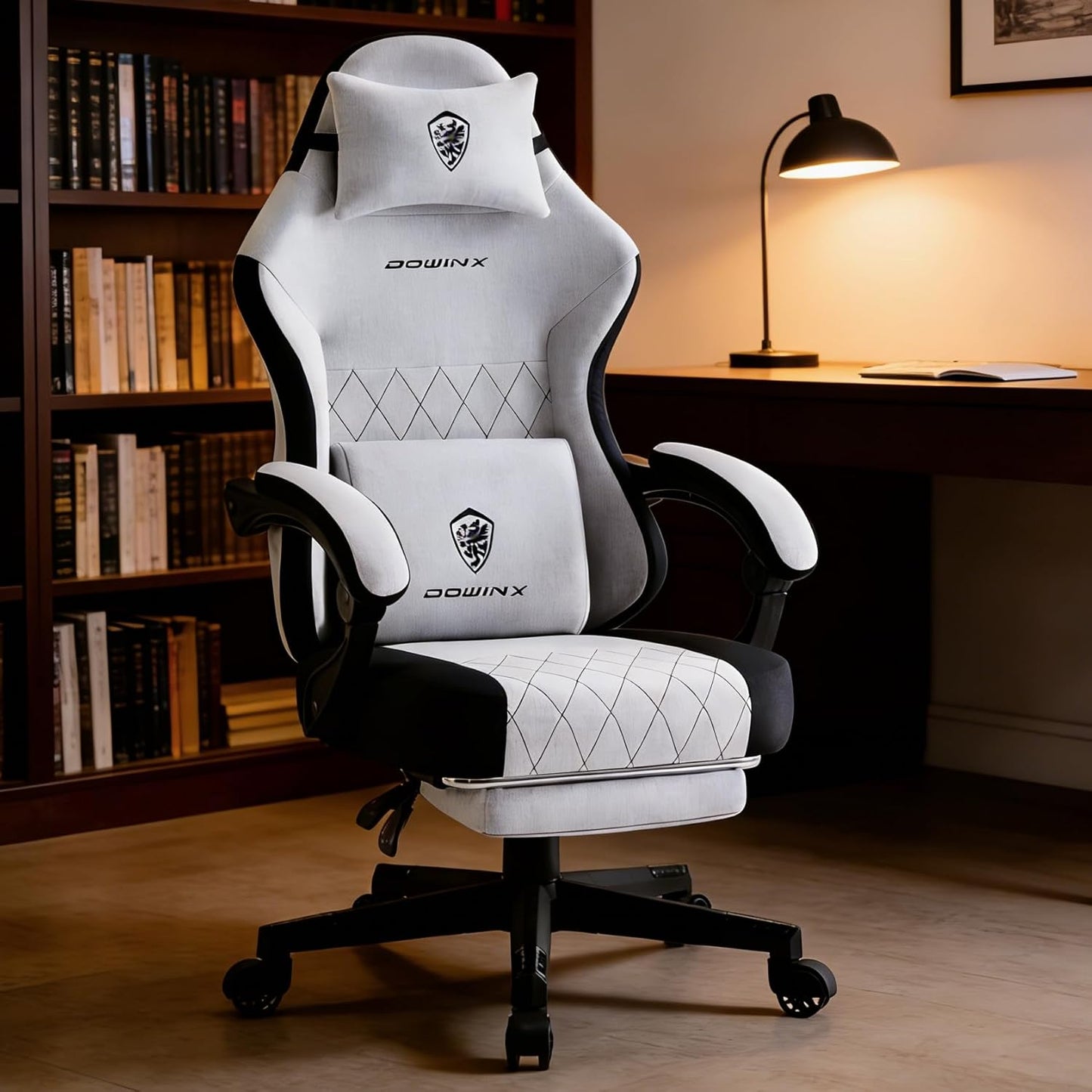 White and black DOWINX gaming chair with lumbar pillow, quilted design, in home office setup