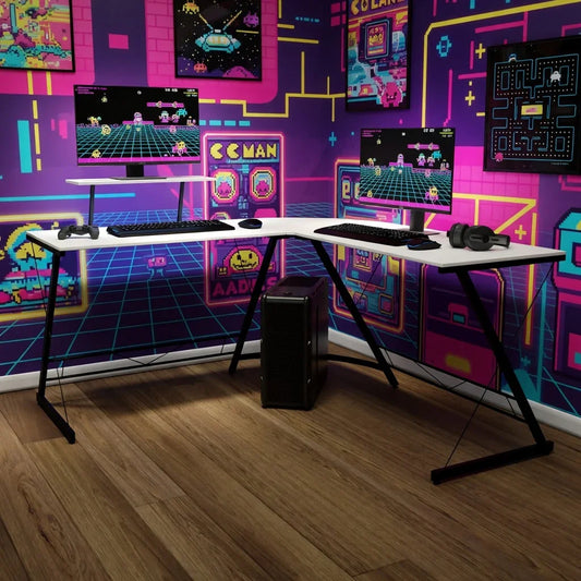 Retro gaming setup with dual monitors, keyboard, headset, and neon 8-bit arcade wall decor
