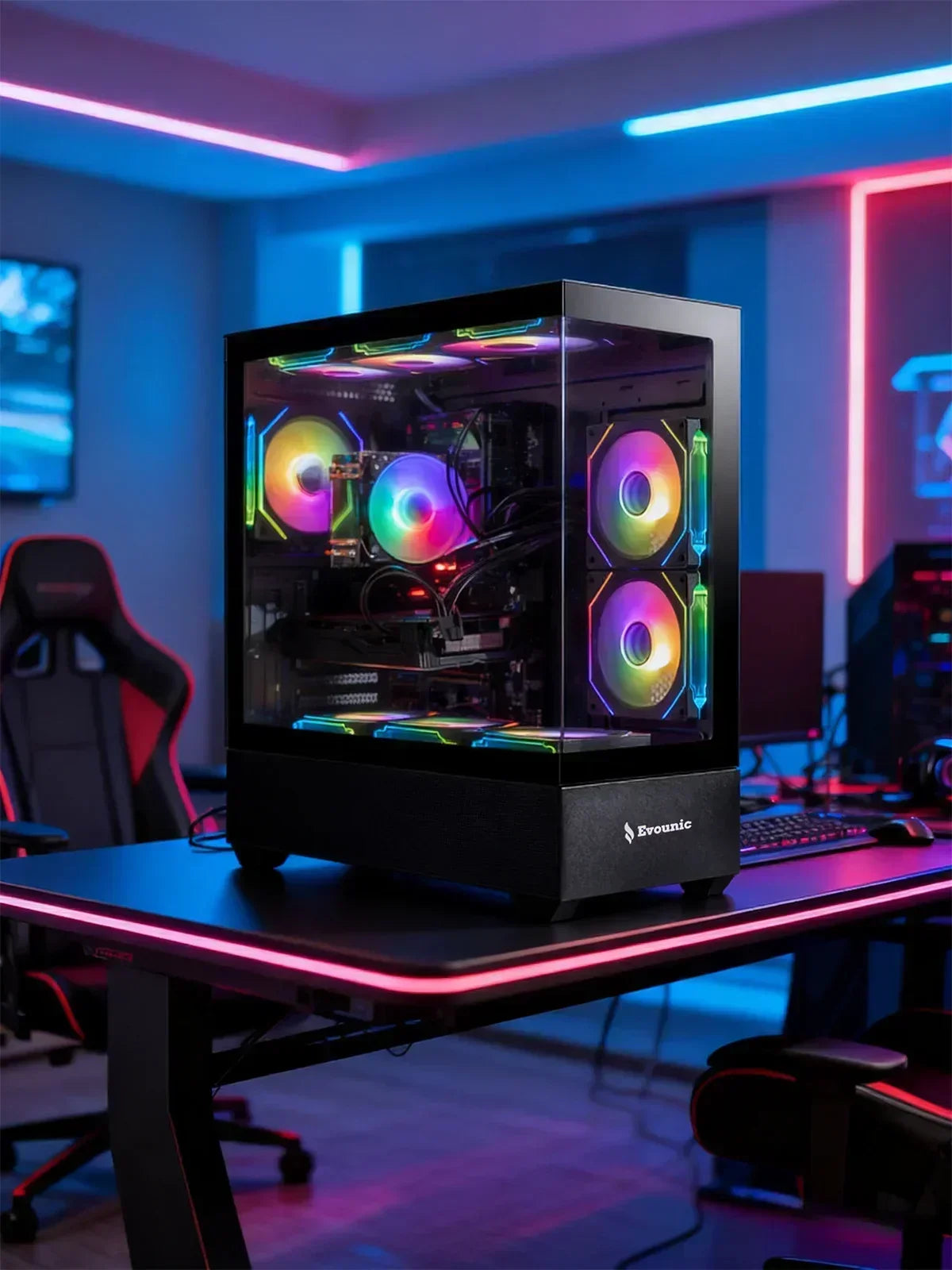 RGB gaming PC with glass case on LED-lit desk in modern gaming setup