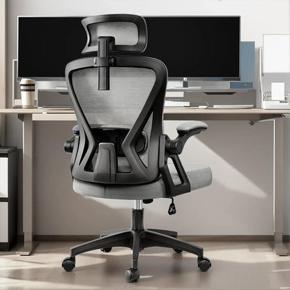 Ergonomic gaming chair with mesh back, adjustable arms, and headrest for desk setup comfort