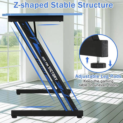 Black and blue Z-shaped gaming desk frame with adjustable leg pads for stability on uneven floors