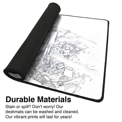 Rolled gaming deskmat with black edges and circuit board design, showcasing durable materials