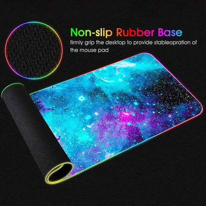 Gaming mouse pad with galaxy design and colorful RGB lighting featuring non-slip textured rubber base for stable desktop grip