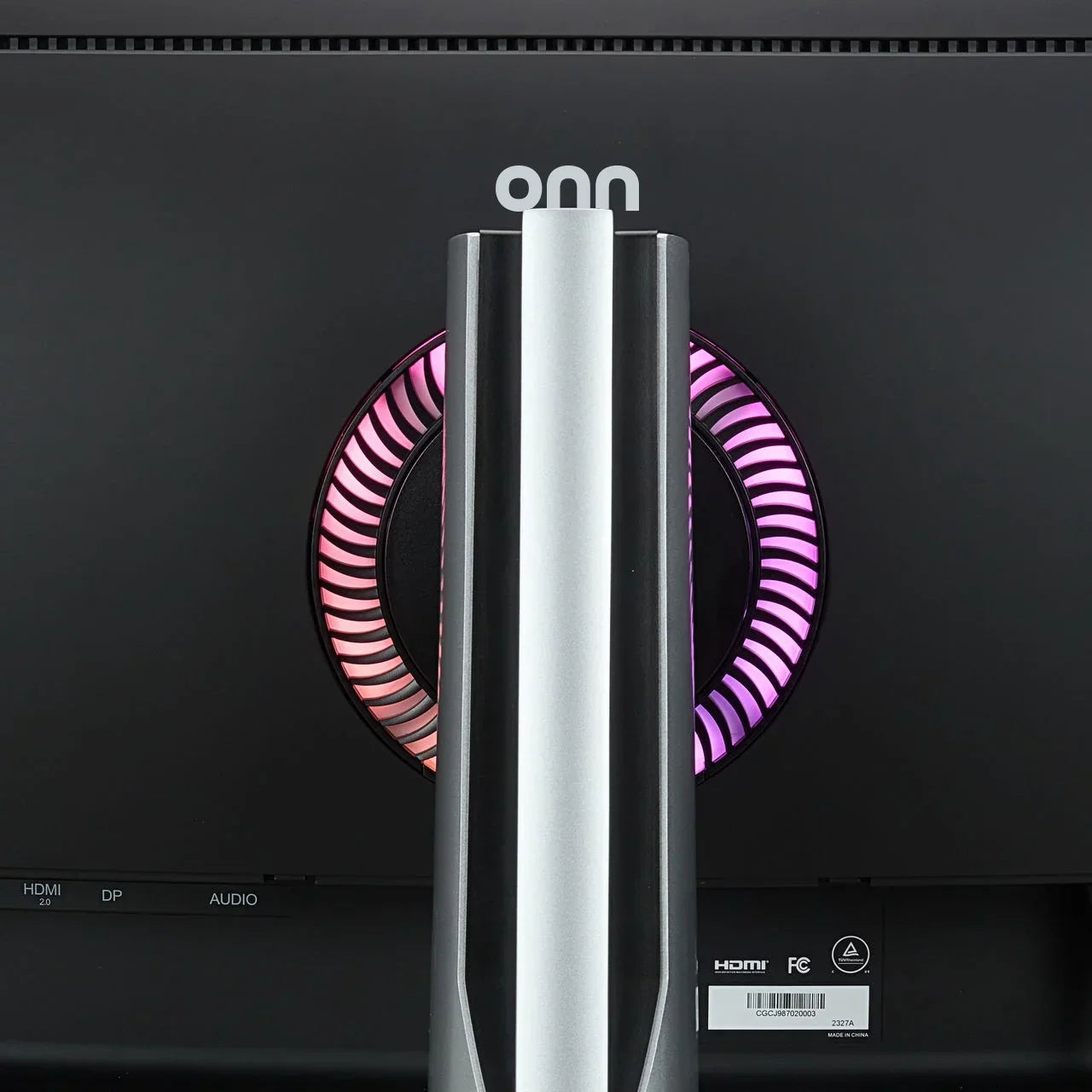 Rear view of a black gaming monitor with RGB lighting ring and HDMI, DP, audio ports