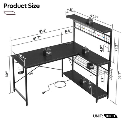 Black L-shaped metal desk with overhead shelf, wire grid panel, and weight capacity labels with inches dimensions