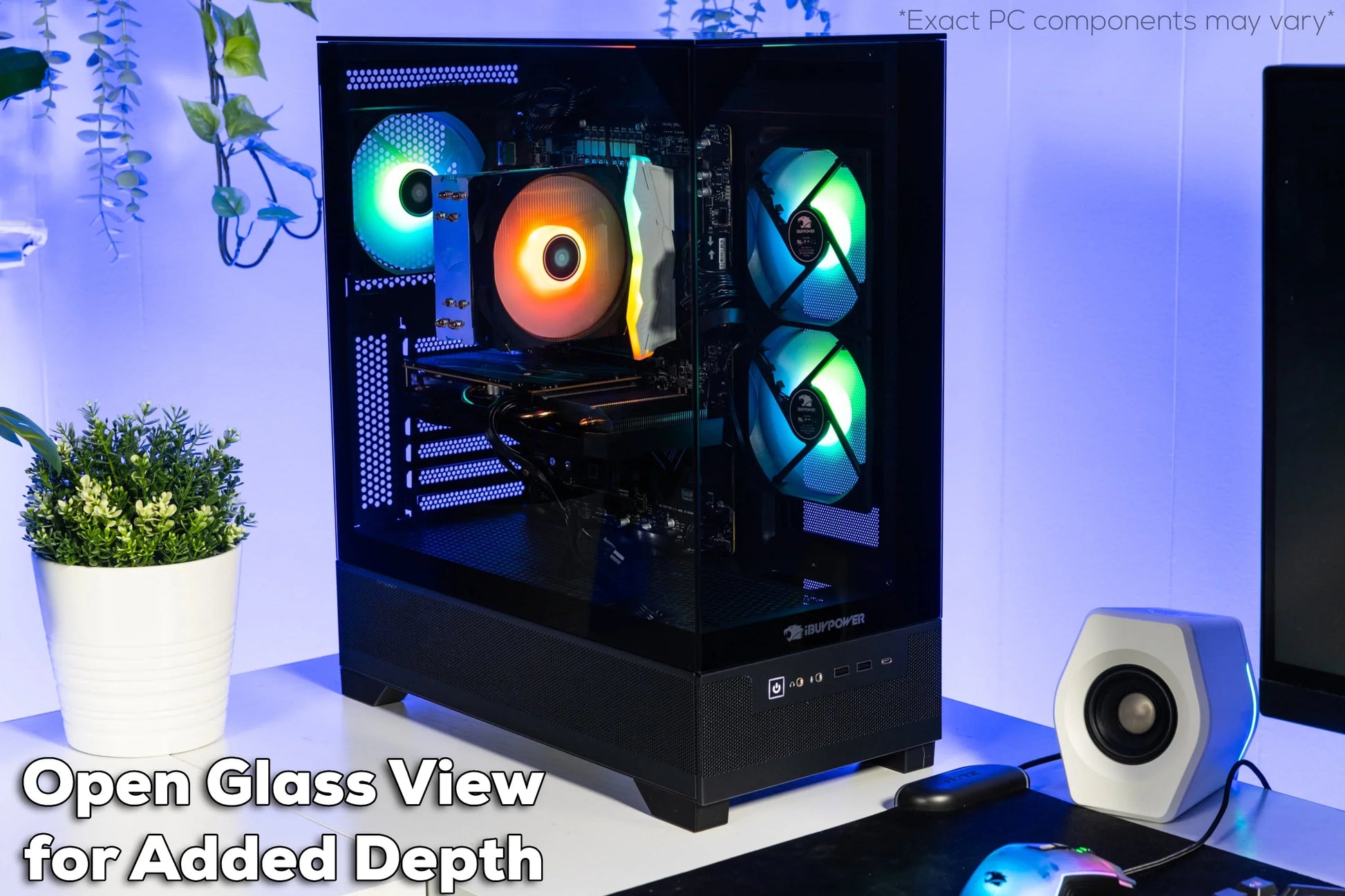 iBUYPOWER gaming PC with glass side panel, RGB cooling fans, CPU cooler, white plant pot and hexagonal speaker on desk