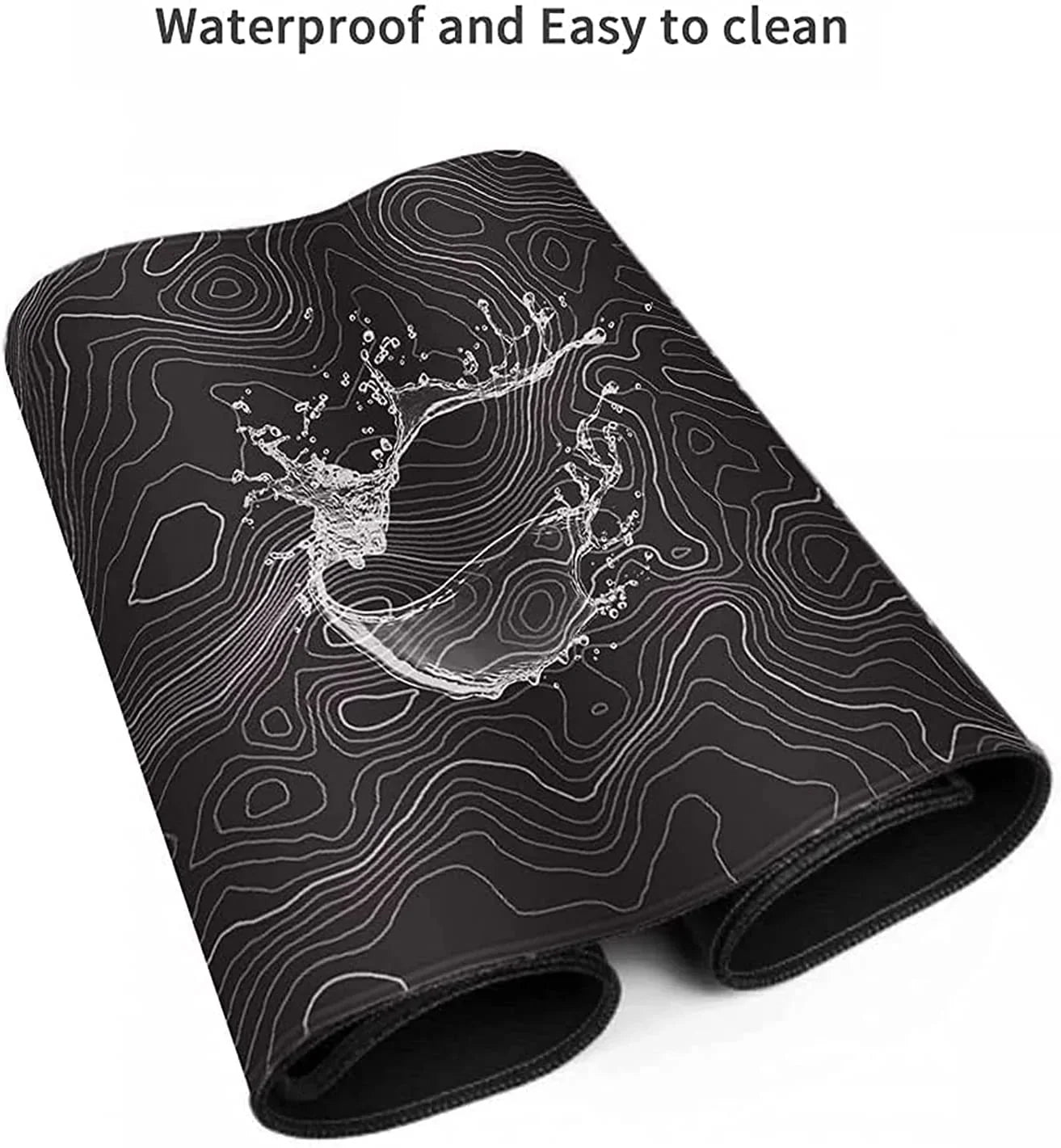 Rolled black gaming mouse pad with waterproof surface and white contour line design showcasing splash of water
