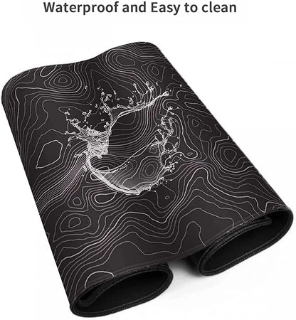 Rolled black gaming mouse pad with waterproof surface and white contour line design showcasing splash of water