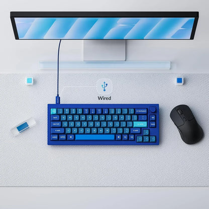 Blue wired gaming keyboard, black mouse, and monitor on a modern Byte Style desk setup.