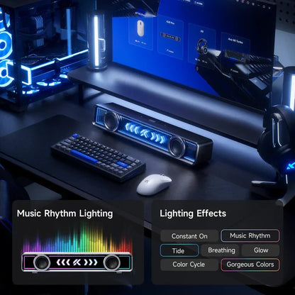 Gaming setup with RGB keyboard, mouse, and music rhythm lighting soundbar for immersive PC gaming experience