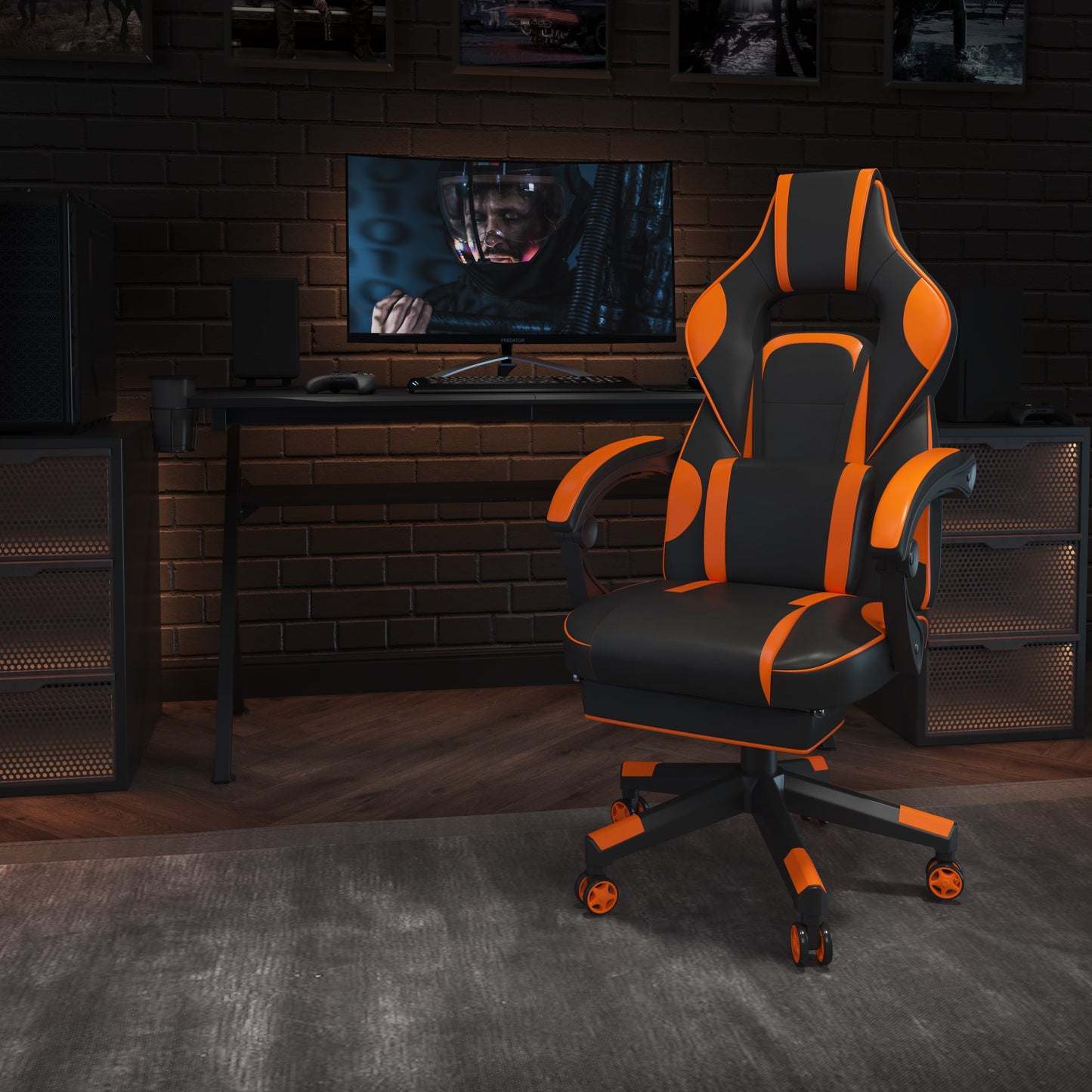 Black and orange gaming chair with ergonomic design in a modern gaming setup