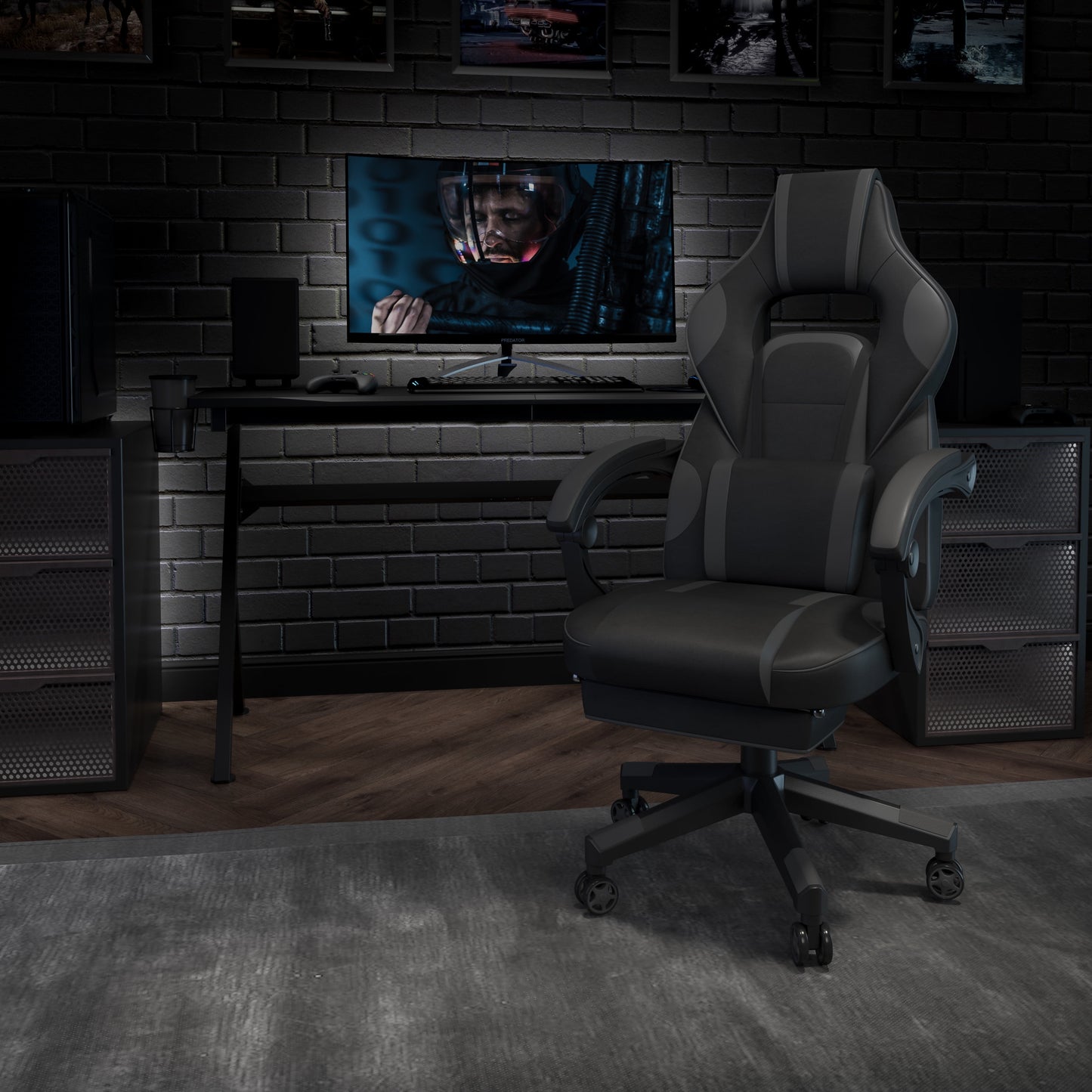 Ergonomic gaming chair in dark gray setup with desk, monitor, and PC for immersive gameplay